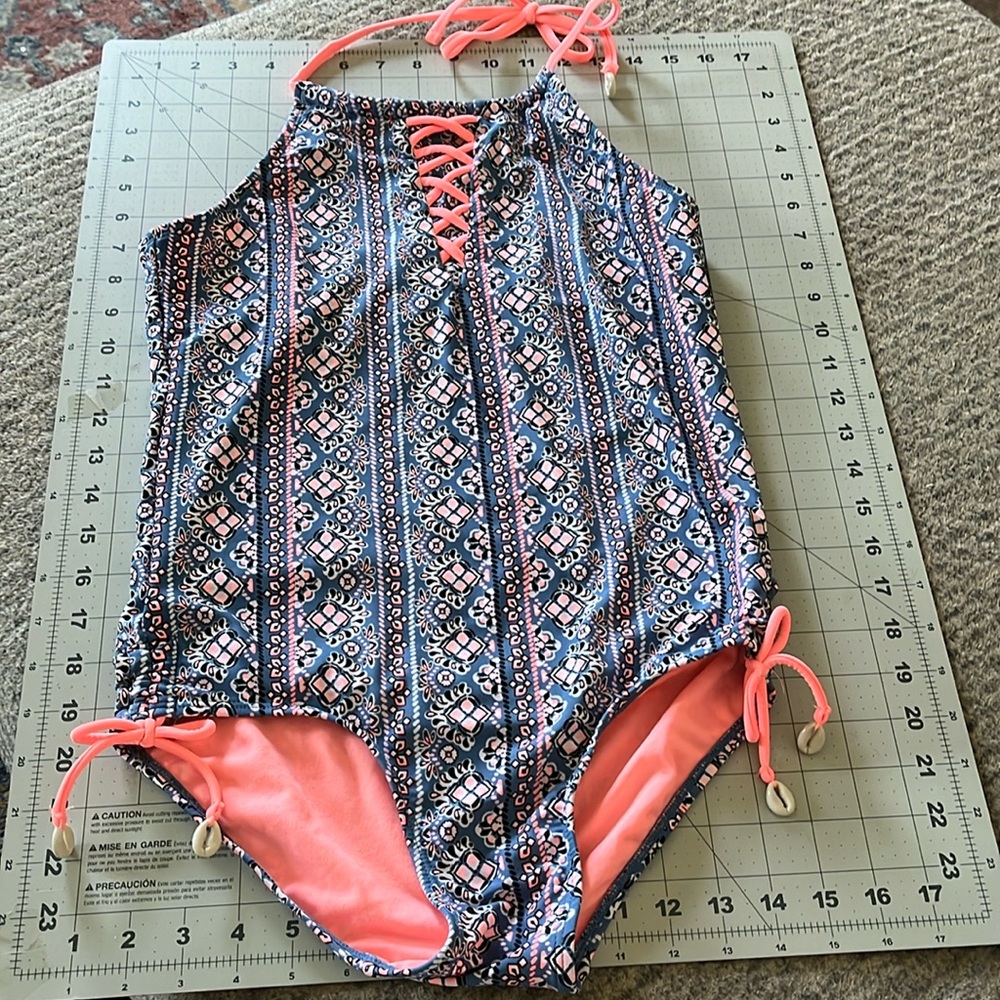 Justice swimsuit. Size 20. Like new! Halter back with puca shell embellishments.